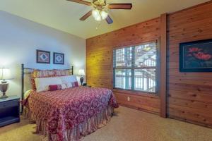 a bedroom with a bed and a ceiling fan at Ace Condos in Pagosa Springs
