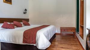 Rúm í herbergi á La Casona Real Cusco