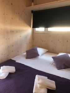 Postel nebo postele na pokoji v ubytování Ecobeachvilla Buqez 9