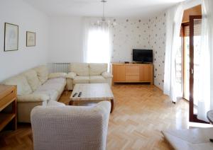 a living room with a couch and a table at Apartment Šverko in Kastav