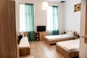 Postel nebo postele na pokoji v ubytování Pensiunea Lms