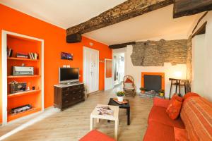 TV a/nebo společenská místnost v ubytování Rivacanze Apartments