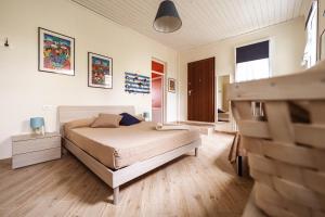 Postel nebo postele na pokoji v ubytování Rivacanze Apartments