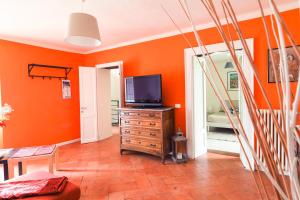 TV a/nebo společenská místnost v ubytování Rivacanze Apartments