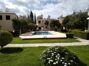 a house with a swimming pool in a yard at The Perfect Vacation Place in Paphos City