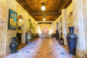 a room with two large vases in a building at Riad Mimouna in Essaouira