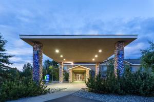 a building with a pavilion with columns in a yard at Holiday Inn Express Anchorage, an IHG Hotel in Anchorage