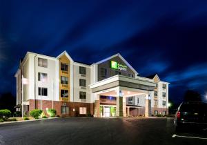 a hotel building with a car parked in front of it at Holiday Inn Express Hillsville, an IHG Hotel in Hillsville