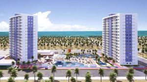 two tall buildings next to the ocean with palm trees at Salinas Exclusive Resort in Salinópolis
