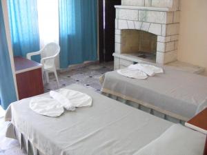 Postel nebo postele na pokoji v ubytování Kemer Hotel