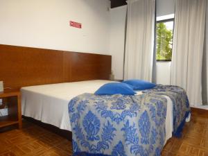Uma cama ou camas num quarto em Campismo Rural Vale dos Moinhos Gerês