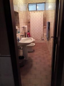 a bathroom with a sink and a toilet and a shower at 3 vani 700 Mt mare e 3000 Mt da Capo D'Orlando in Naso