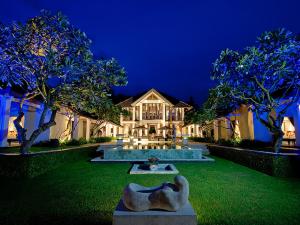 a house with a statue in front of it at night at The Ylang Ylang in Saba