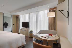 Μια τηλεόραση ή/και κέντρο ψυχαγωγίας στο Jasper Young Hotel Banqiao