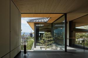 a glass house with a tree inside of it at Park Hyatt Kyoto in Kyoto