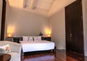 A bed or beds in a room at K Gallery Hotel