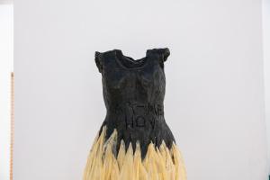 a black and gold dress with the words hereditaryflow on it at Casa Carmen Morelos in Oaxaca City
