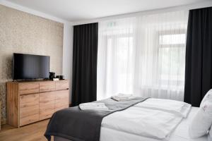 Posteľ alebo postele v izbe v ubytovaní Apartamenty, Boutique Rooms Villa 82, MIEJSCE PRKINGOWE