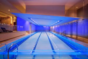 a swimming pool with blue lights in a building at Andaz Xintiandi Shanghai-Free Minibar & Lounge Happy Hour in Shanghai