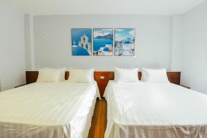 Postel nebo postele na pokoji v ubytování Catba Buffalo Hostel