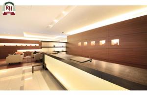a lobby with a reception desk in a building at Richmond Hotel Tokyo Shiba in Tokyo