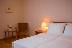 Una cama o camas en una habitación de Vila Bled