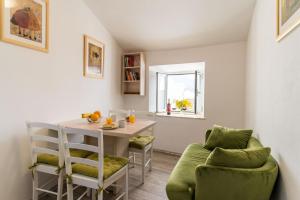 a small dining room with a table and chairs at Apartment Mo-Mo in Dubrovnik