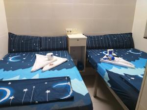 Postelja oz. postelje v sobi nastanitve Unique Hostel