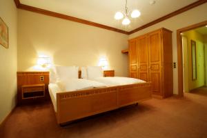 Ένα ή περισσότερα κρεβάτια σε δωμάτιο στο Hotel Le Prese