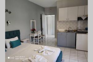 a kitchen with a large bed in a room at Iason studio 2 in Patitiri