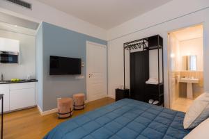 A bed or beds in a room at Suite della Pigna