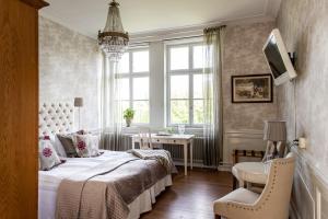 Postel nebo postele na pokoji v ubytování Rånäs Slott