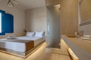 Ένα ή περισσότερα κρεβάτια σε δωμάτιο στο Pasithea Suites