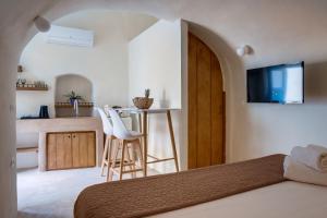Ένα ή περισσότερα κρεβάτια σε δωμάτιο στο Pasithea Suites