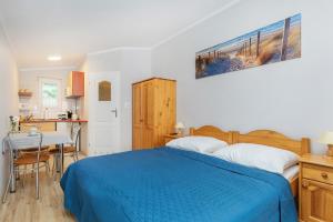Posteľ alebo postele v izbe v ubytovaní AMBER DZIWNÓW - Pokoje i Apartamenty & SPA