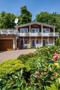 Vonkajšia záhrada v ubytovaní AMBER DZIWNÓW - Pokoje i Apartamenty & SPA