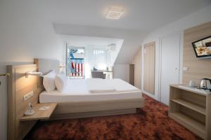 Postel nebo postele na pokoji v ubytování Hotel Brenner