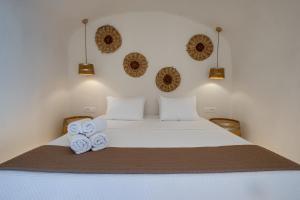 Ένα ή περισσότερα κρεβάτια σε δωμάτιο στο Pasithea Suites