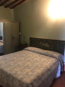 Postel nebo postele na pokoji v ubytování La Locanda del Loggiato
