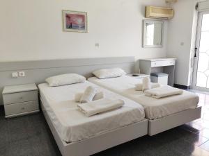 Postel nebo postele na pokoji v ubytování Atrium Apartment #1