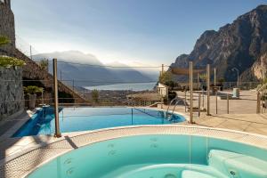 a swimming pool with a view of a mountain at Agritur Acetaia Gourmet&Relax in Tenno