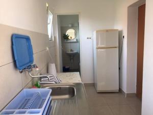 Kuchyň nebo kuchyňský kout v ubytování Apartmani Stula