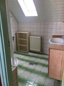 a bathroom with a toilet and a sink and a tub at Fanni Guest House in Balatonvilágos