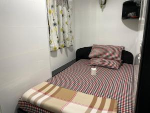 Ένα ή περισσότερα κρεβάτια σε δωμάτιο στο Budget Hostel Block D 10th Floor