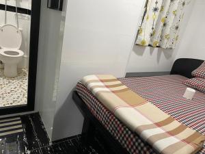 Ένα ή περισσότερα κρεβάτια σε δωμάτιο στο Budget Hostel Block D 10th Floor