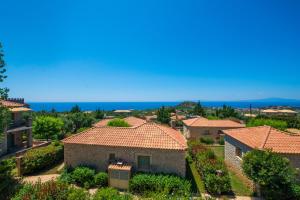 an aerial view of a villa with tile roofs at Ifigenia's Apartments in Stoupa