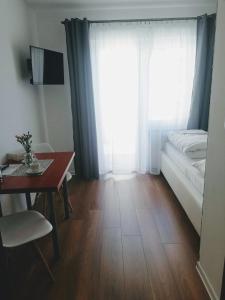 Łóżko lub łóżka w pokoju w obiekcie D.W. JULIA