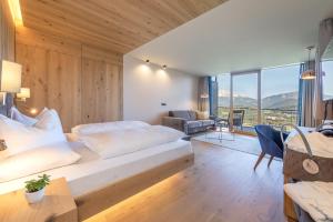 Postel nebo postele na pokoji v ubytování Panoramahotel Obkircher + 37 fotografií