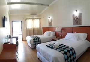 Letto o letti in una camera di Express Inn Coronado & Camping