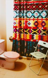 a bathroom with a toilet and a shower curtain at 231TR by the Betty Roux Heritage in Kuala Lumpur